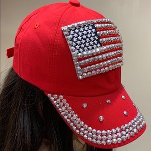 Red cap with American flag and rhinestones around
